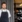 Kok i sort forklæde foran restaurant