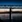 Comwell Kongebrogaarden bro over vand ved solnedgang