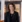 Smilende medarbejder i sort blazer med Comwell-badge