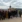 Gruppe foran historisk kapel med panoramaudsigt over by
